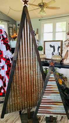 two christmas trees made out of old corrugated sheets