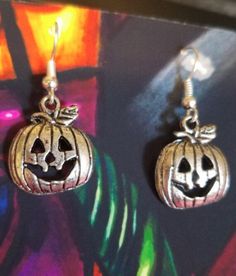 This is a pair of Jacko lantern pumpkin charm Halloween earrings. They are 1 1/4 inches long. Fun fall or holiday earrings  Item#jewls6071 Spooky Nickel-free Silver Earrings, Spooky Silver Nickel-free Earrings, Silver Spooky Halloween Earrings, Nickel-free Silver Earrings For Halloween, Earrings Halloween, Holiday Earrings, Pumpkin Earrings, Holiday Earring, Halloween Earrings