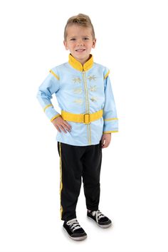 a little boy dressed in a blue and yellow uniform