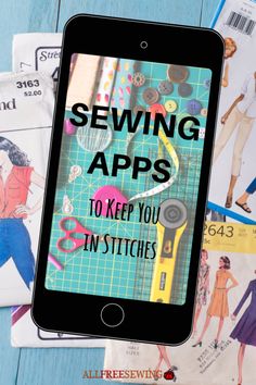 an iphone with sewing app on it sitting next to other sewing supplies and paper towels