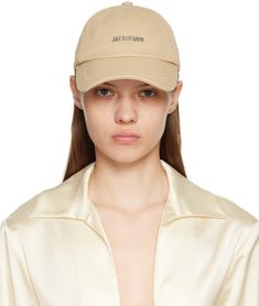 Cotton twill cap in beige. Logo plaque at face. · Embroidered eyelet vents at crown · Curved brim · Cinch fastening at back face · Cotton twill browband · Silver-tone hardware Part of the Le Papier collection. Supplier color: Beige Luxury Beige Visor Baseball Cap, Jacquemus Beanie, Jacquemus Hat, Designer Beige Baseball Cap, Jacquemus Cap, Curator Style, Luxury Streetwear, Cotton Twill, Hats For Women