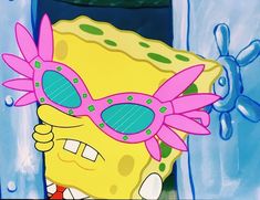 the spongebob is wearing sunglasses in front of a blue door with pink flowers on it