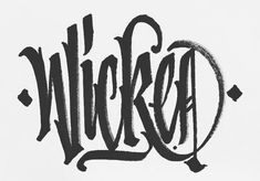 the word wicka written in black ink