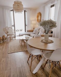 a living room filled with furniture and a wooden table