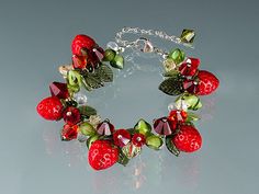 Handmade Glass Strawberry Bracelet with lifelike glass strawberries. A treasured gift for your gardener, foodie or gourmet cook.  $399.   By Elizabeth Johnson.  Click here to ship! Glass Strawberries, Strawberry Bracelet, Hand Blown Glass Art, Fruit Jewelry, Glass Lampwork, Blown Glass Art, Boulder Co, Red Strawberry, Art Birthday