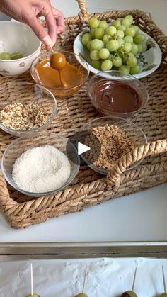 an assortment of food is being prepared on a wicker tray with apples and other ingredients