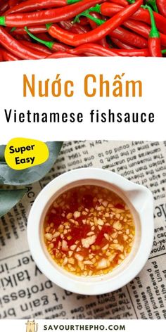 a bowl filled with red peppers next to a pile of green chilis and the words nuoc cham vietnamese fish sauce