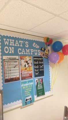 a bulletin board with balloons hanging from it's sides and what's up on campus