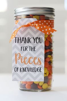 a jar filled with candy and a tag that says thank you for the pieces of knowledge