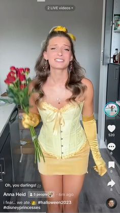 a woman in a yellow corset is holding flowers and posing for the camera