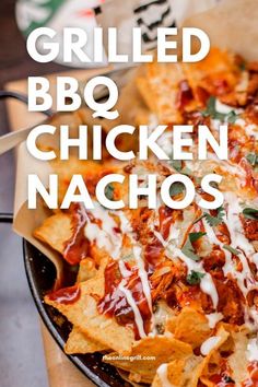 grilled bbq chicken nachos in a skillet with cheese and sauce