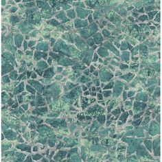 an image of a textured surface that looks like rocks or stones with green paint on it