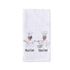 two chefs are cooking in the kitchen on a white dish towel that says head chef and sous chef