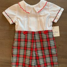 This Is A Brand New Sophie And Lucas 2 Piece Short Set. The Shorts Are A Bright Christmas Plaid And The Top Is A Short Sleeve White With Matching Plaid Trim Around The Arms. The Collar Has Beautiful Bright Red Stitching. The Top Buttons Up The Back And The Shorts Button Onto The Shirt. All Of My Items Are New From My Closed Children's Store. I Am Listing At Fair Prices So Please Do Not Send Silly Offers Fitted Red Set For Holidays, Red Cotton Holiday Set, Christmas Cotton Playtime Sets, Fitted Cotton Christmas Sets, Cotton Sets For Playtime During Holidays, Cotton Playtime Sets For Holiday, White Holiday Playtime Sets, Holiday White Fitted Sets, Fitted Red Playwear Sets