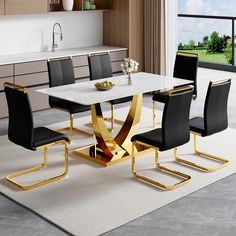 a modern dining table with black chairs and a white rug in the middle of it