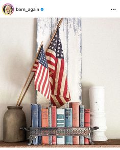 an american flag and books on a shelf