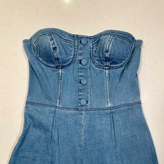 Strapless Bustier Denim Jumpsuit In Cropped Length. Perfect Worn On Own Or Layered Over A Top. Fitted Denim Strapless Jumpsuits And Rompers, Strapless Fitted Denim Jumpsuits And Rompers, Strapless Fitted Denim Jumpsuits, Fitted Strapless Denim Jumpsuit In Blue, Fitted Strapless Denim Blue Jumpsuit, Fitted High Waist Blue Denim Jumpsuit, Fitted Blue Denim Jumpsuit With High Waist, Blue Fitted High Waist Denim Jumpsuit, Blush Pink Jumpsuit