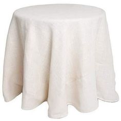 a white table cloth on top of a round table