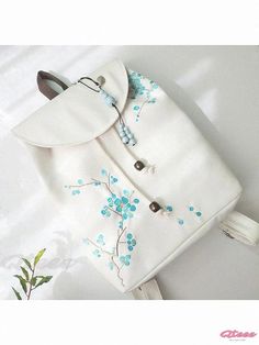 Qteee - Classic Floral Embroidered Backpack for a Timeless Look Trendy Embroidered Backpack, Trendy Embroidered Backpack For Everyday Use, White Standard Backpack For Spring, Spring White Backpack For Daily Use, White Backpack For Daily Use In Spring, Trendy Embroidered School Backpack, Embroidered Backpack For Daily Use, Embroidered Shoulder Backpack For Daily Use, Casual White Backpack For Gift