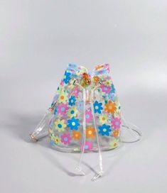 Introducing our Flower Power Jelly Bags - the ultimate beach accessory! This clear bucket bag features a colorful flower design that perfectly matches our icon espadrille sandals. Keep your swim and beachwear organized and in style with this must-have bag. Don't settle for anything less when it comes to your beach day essentials. Jelly Bags, Picnic Snacks, Waterproof Beach Bag, Chic Crossbody Bag, Clear Purses, Jelly Bag, Beach Tote Bag, Beach Sports, Transparent Bag