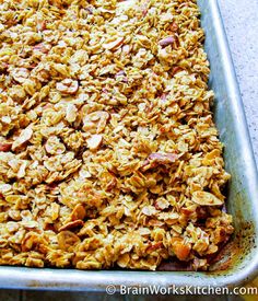 a pan filled with granola sitting on top of a counter