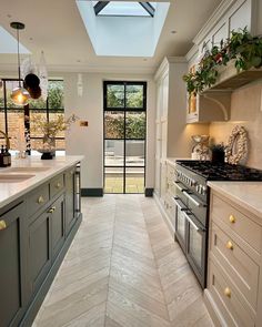 an instagramted photo of a kitchen with white cabinets and gray countertops on the bottom right hand corner