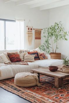 a living room filled with lots of furniture and decor on top of a wooden table