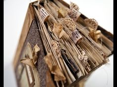 an open book with many different things on it's cover and tags attached to the pages