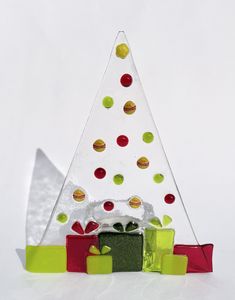 a glass christmas tree with presents under it