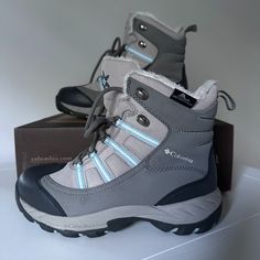 Excellent Condition Never Worn. Stay Warm And Dry This Winter With These Columbia Whirlibird Boots In Blue Gray. Perfect For Outdoor Activities, These Boots Feature A Waterproof Exterior And Insulated Interior To Keep Your Feet Cozy. The Mid-Calf Boot Shaft Height And Ankle Style Provide A Comfortable Fit, While The Low Heel And Rubber Outsole Ensure Stability On Any Terrain. The Round Toe Shape, Lace-Up Closure, And Block Heel Style Are Both Practical And Stylish, And The Accents Of Fur Trim, L Columbia Boots, Brown Winter Boots, Black Snow Boots, Black Winter Boots, Columbia Shoes, Waterproof Snow Boots, Fur Lined Boots, Waterproof Winter Boots, Leather Lace Up Boots