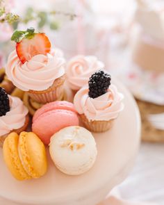 there are many different types of cupcakes on the plate