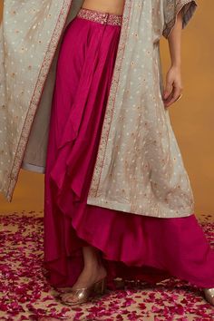 Grey three fourth flared sleeves chanderi shrug with florin dori embroidery and bandhej motif pattern detailing. Paired with a pink padma bloom dori embroidered sweetheart neck blouse and an embroidered waistband draped skirt with layered ruffles detailing. - Aza Fashions Sweetheart Neck Blouse, Dori Embroidery, Shrug Pattern, Motif Pattern, Draped Skirt, Sweetheart Neck, Set For Women, Flared Sleeves, Aza Fashion