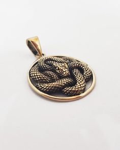 This item is made to order. Casting in any metal will take 14-19 days. Please, leave your orders.Astonishing snake pendant, unisex. Bronze or silver, with or without leather cord.Size - 1 inches / 2,6 cmWeight for bronze -  5,8 g.Weight for silver -  7,1 g.✤ If you have any questions - feel free to ask! Snake-shaped Engraved Jewelry Gift, Nickel-free Snake-shaped Jewelry Gift, Engraved Snake-shaped Jewelry Gift, Bronze Snake-shaped Jewelry For Gift, Spiritual Brass Snake-shaped Jewelry, Spiritual Brass Jewelry In Snake Shape, Engraved Metal Snake-shaped Jewelry, Bronze Snake-shaped Jewelry Gift, Bronze Snake Shape Jewelry As Gift