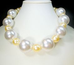 "Big White & Champagne Pearl Choker Necklace, OoAK, My Design w 2 Size Resin Pearls This piece is costume glam holiday. LOOK AT ME  ..the large Champagne & white pearl beads have enough shiny luster for any kind of party.    The large white shiny pearl beads are each 1\" ( 2.54cm  ) this very glamorous CHOKER necklace is 17\" long ( 43.18cm )    This Necklace is From the Design House of RACHELLE STARR.  A haute couture, OOAK Art to Wear Atelier __ Note to Customers:    I ONLY ship to your paid E Vintage Napkin Rings, Pearl Clasp, White Champagne, Pearl Necklace Vintage, Buddha Pendant, Electronic Media, Beaded Collar, Pearl Choker Necklace, Art To Wear