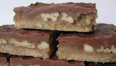 several pieces of chocolate and almond bars stacked on top of each other