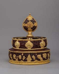 an elaborately decorated box with gold decoration