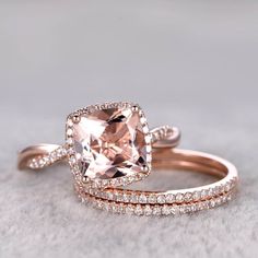 an engagement and wedding ring set in rose gold with a cushion cut morganite surrounded by pave diamonds