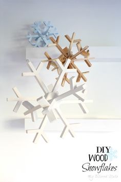 a snowflake made out of pieces of wood sitting on top of a table