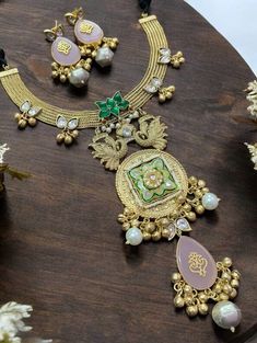 Sabyasachi Inspired Polki Hasli Necklace, featuring Kundan and a unique gold-plated pendant. Perfect for a Bollywood-inspired look, pair it with a classic lehenga or saree. Complement with a simple updo and understated earrings to let the necklace remain the focal point of your outfit. *𝐏𝐑𝐎𝐃𝐔𝐂𝐓 𝐃𝐄𝐓𝐀𝐈𝐋* * Material: Brass * Plating: Gold Plated. * Stone: Semi Precious Carved Stones, Kundan, Polki *𝐃𝐈𝐒𝐂𝐋𝐀𝐈𝐌𝐄𝐑* Product color may slightly vary due to photographic lighting sourc Gold Meenakari Kundan Necklace In 22k Gold, Gold 22k Meenakari Kundan Necklace, Gold Meenakari Chandbalis For Celebration, Gold Kundan Pendant Temple Necklace, Gold Plated Chandbali Necklaces For Ceremonies, Gold Kundan Necklace With Latkans, Gold Plated Chandbali Necklaces For Ceremonial Occasions, Chandbali Kundan Necklace In Yellow Gold For Celebrations, Gold Chandbali Necklace With Latkans