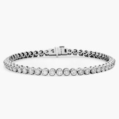 Simple and brilliant, this classic tennis bracelet features round, brilliant diamonds framed in 14k white gold. Pearl Jewelry Gift, Platinum Chain, Platinum Rose Gold, Gold Rings Fashion, Diamond Tennis Bracelet, Gold Pearl Necklace, Ladies Diamond Rings, Tennis Bracelet Diamond, Engagement Ring Styles