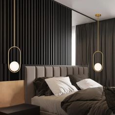 a bedroom with black and white striped walls, two lamps hanging from the ceiling above the bed