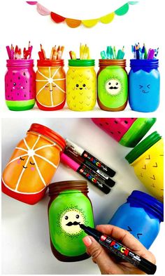 there are many colorful jars with faces painted on them and one has a marker pen in it