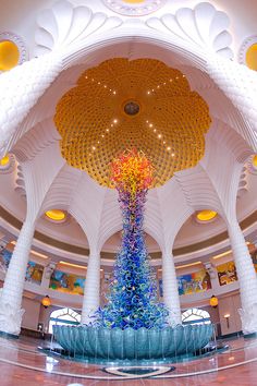 the inside of a building with an elaborate ceiling and colorful decorations on the walls,