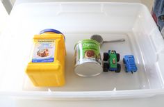 a plastic container filled with different types of toys and items to make it look like they are