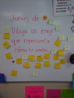 a bulletin board with post - it notes and spanish words on it, all written in different languages