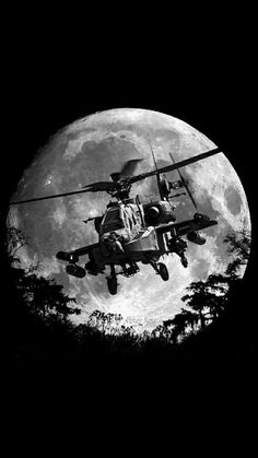 a black and white photo of a helicopter flying in front of the moon with trees