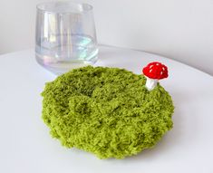 ᆞThis multifunctional item serves as more than just a coaster--it can also be used as a jewelry tray, ring dish, trinket or as a base for a small plant. ᆞIt resemble soft grass and moss, infusing your home with a vibrant green ambiance. ᆞAlthough it's a perfect mug rug and coaster, because it's made of fluffy yarn, it's not suitable for tall cups or cups with narrow bottom. ᆞDimension: Diameter approximately 11cm(4 1/2inch) Please note that every coaster is handmade and no two will be exactly th Yarn Mushroom, Moss Mushroom, Crochet Moss, Goblincore Decor, Moss Grass, Mushroom Crochet, Fairy Garden Party, Frog Gifts, Fluffy Yarn