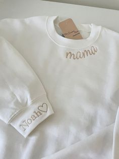 a white sweater with the word mama on it