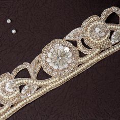 Beautiful Light Golden Zardozi Glass Bead and Pearl Floral Lace Trim | Embroidered Cut-Work Ribbon for Wedding Sash, Dress Embellishment This beautiful Lace can be used for designing stylish blouses, shrugs, skirts, tunics, festive wear, wedding wear and dresses. This stunning lace trim is great for any sewing and craft projects. A perfect embellishment for a bridal dresses or for any festive mood outfit. Our lace will add mystique to your fabric, you can use this lace alone or add it with other laces to create a new unique design for, any of your project : ➤dress border, dupattas, scarves and veils ➤jewelry making, ➤for making a DIY belt ➤designing stylish blouses, ➤waist belt to match your plain outfit ➤festive wear, wedding wear, dresses ➤Embellish your clutch purses ➤Can also be incorp Festive Gold Embellished Bridal Belt, Gold Embellished Bridal Belt For Festive Occasion, Elegant Gold Embroidered Bridal Belt, Traditional Embroidered Bridal Belt For Wedding, Embroidered Bridal Belt For Wedding, Festive Embroidered Bridal Belt For Wedding, Elegant Bridal Belt For Wedding And Festive Occasions, Festive Embroidered Bridal Belt, Elegant Embroidered Bridal Belt For Wedding