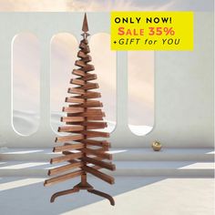 a wooden christmas tree is on sale for $ 50 off at the end of december